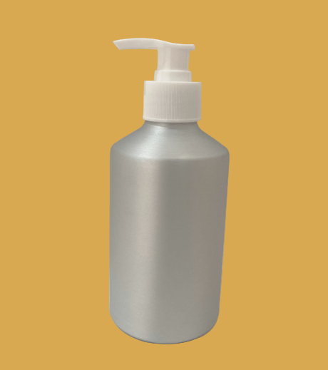 Aluminum bottle with a white pump on a orange background