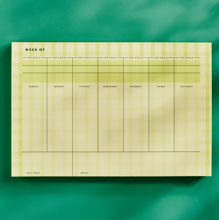 Weekly planner sheet with days of the week on a green background