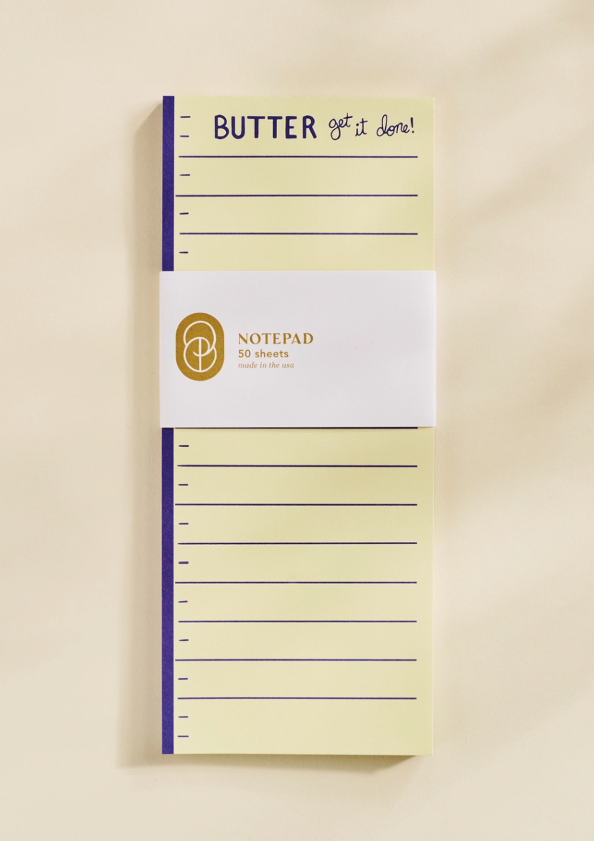 Notepad with 'Butter get it done!' text on a beige background