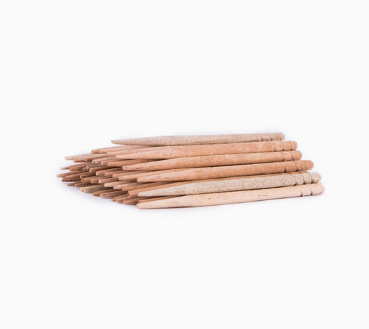 Stack of wooden sticks on a white background