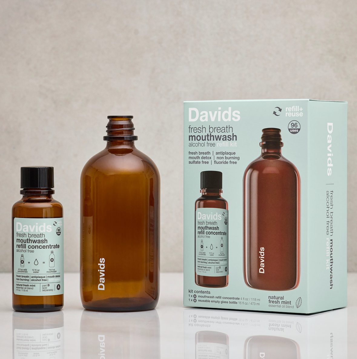 Davids mouthwash bottles and packaging on a reflective surface with a neutral background