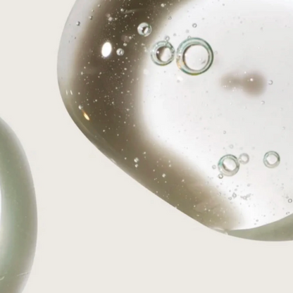 Close-up of gentle cleanser with bubbles on a light background