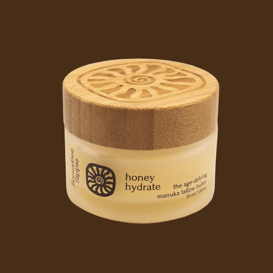 Jar of honey hydrate with a wooden lid on a white background