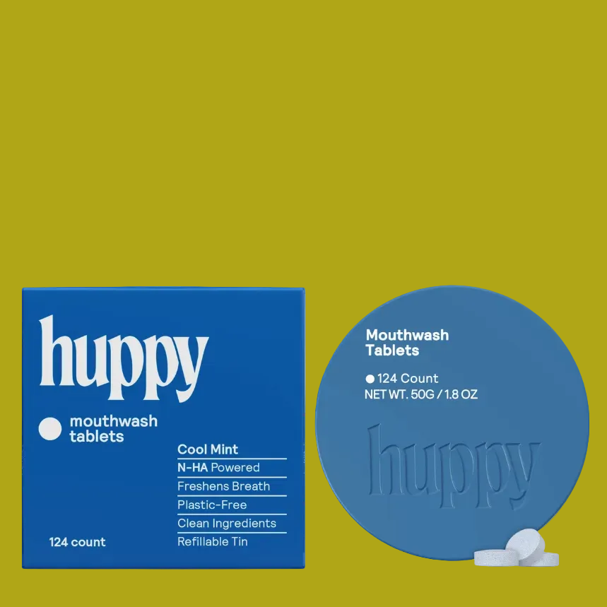 Huppy mouthwash tablets packaging shown on a white background, featuring a blue box labeled 'huppy mouthwash tablets' and a matching blue round tablet tin with a few white tablets in front.