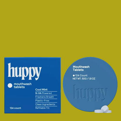 Huppy mouthwash tablets packaging shown on a white background, featuring a blue box labeled 'huppy mouthwash tablets' and a matching blue round tablet tin with a few white tablets in front.