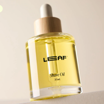 Bottle of LEAF Shave Oil on a neutral background