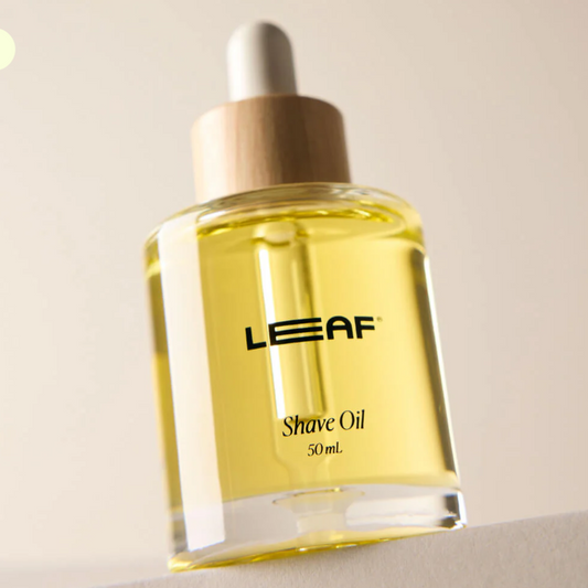 Bottle of LEAF Shave Oil on a neutral background