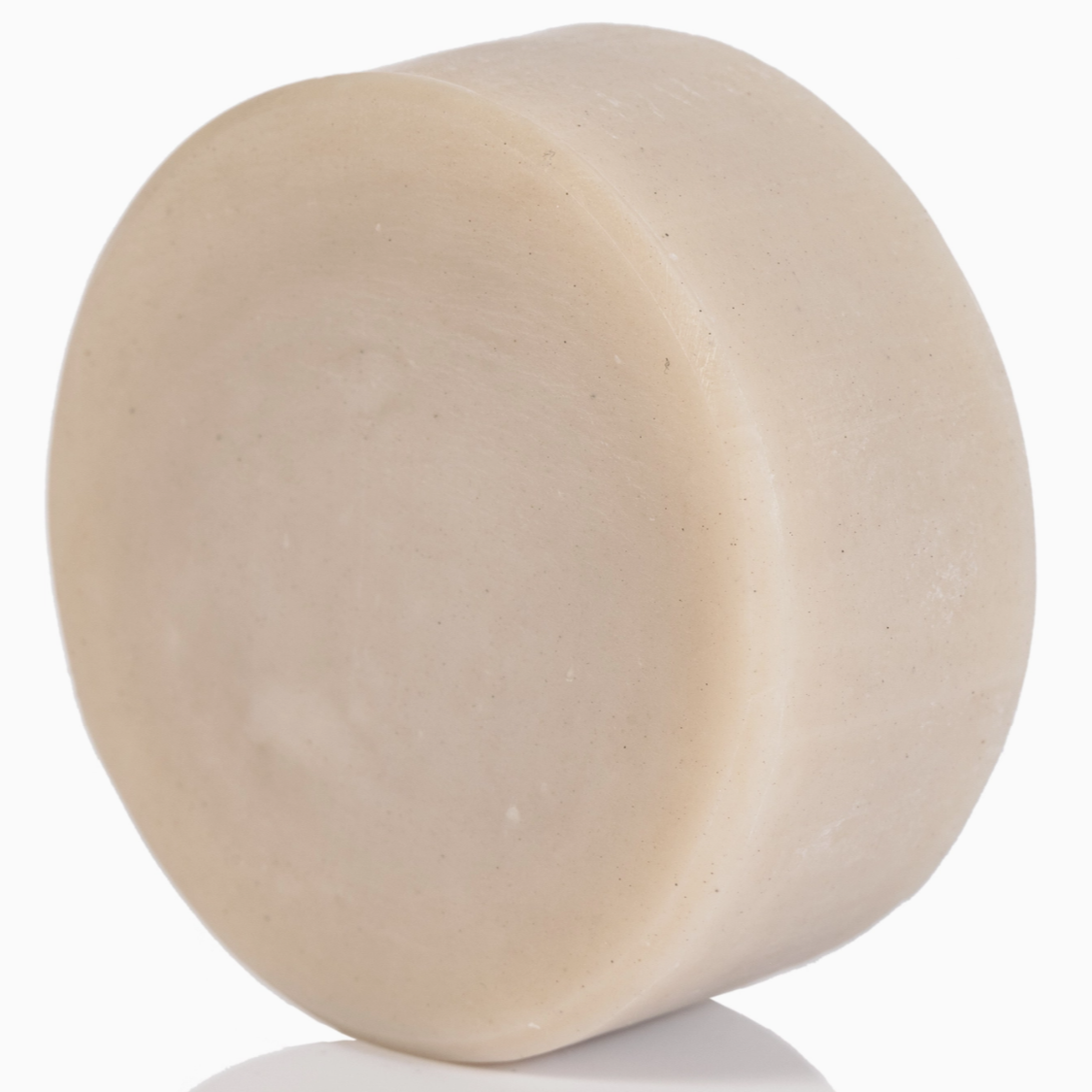 Beige bar of soap on a white background