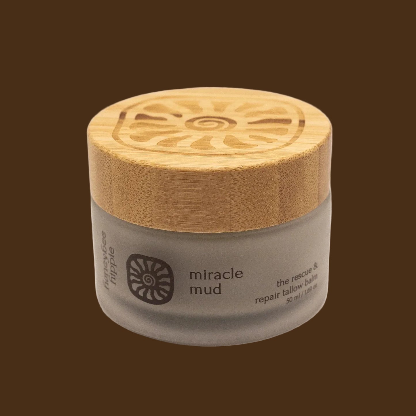 Jar of 'miracle mud' with a wooden lid on a white background