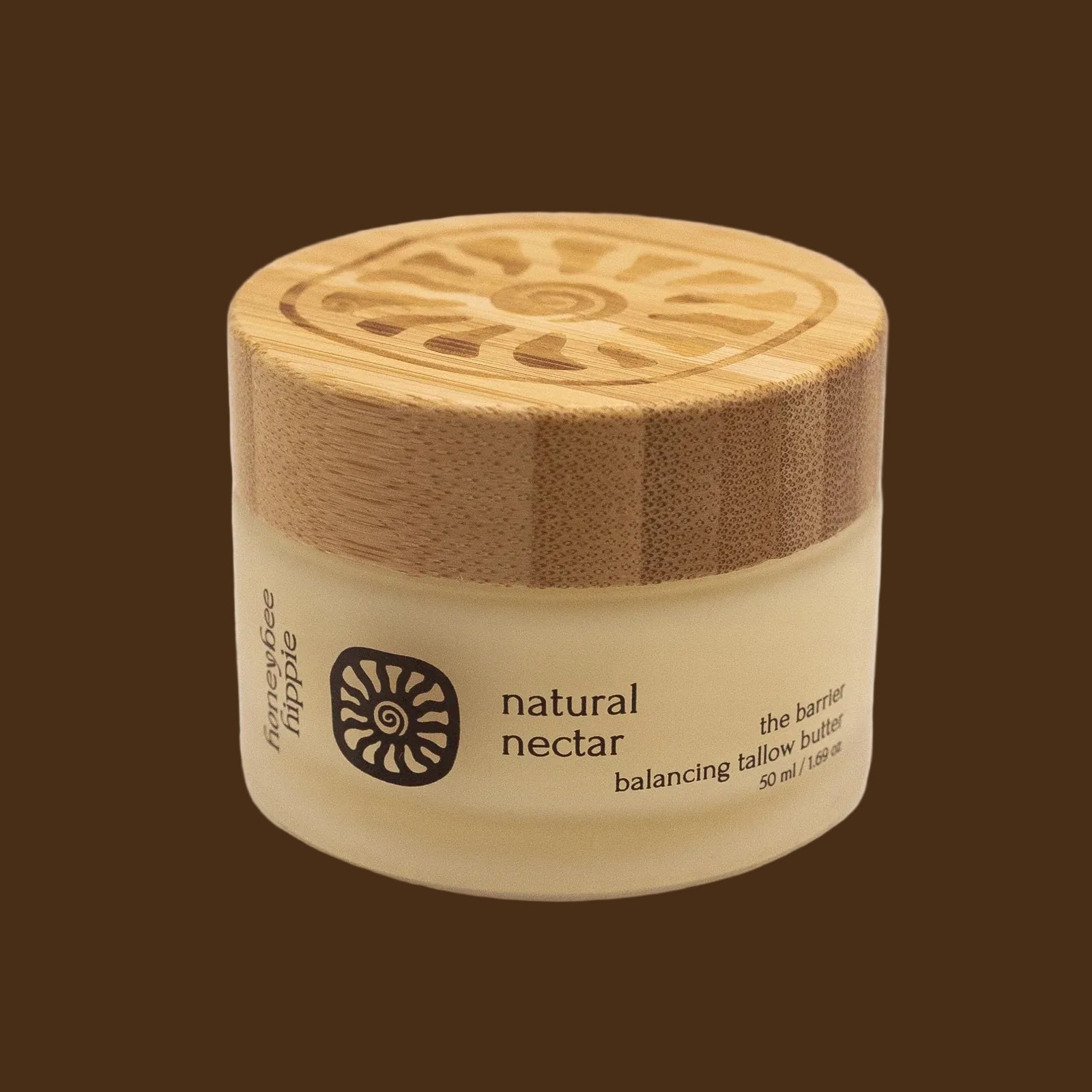 Jar of 'natural nectar' with a wooden lid on a beige background