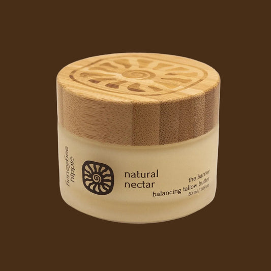 Jar of 'natural nectar' with a wooden lid on a beige background
