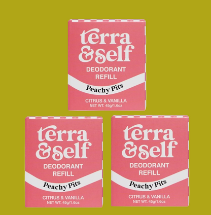 Three pink Terra & Self deodorant refill boxes arranged in a triangle on a white background. The boxes are labeled 'Peachy Pits' and 'Citrus & Vanilla'.