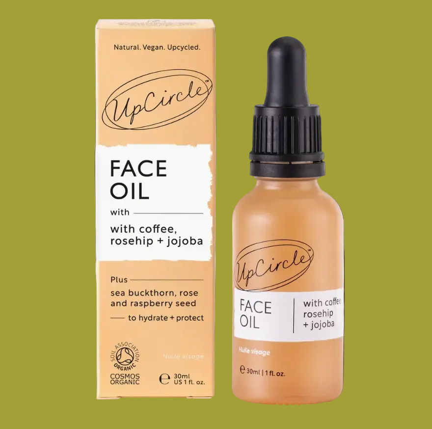 UpCircle Face Oil packaging and bottle on a brown background