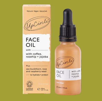 UpCircle Face Oil packaging and bottle on a brown background